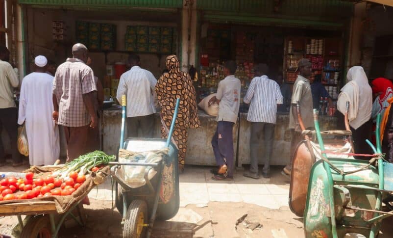 Sudanese buy their groceries from a local vendor during the month of Ramadan in the city of Omdurman